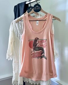 This beachy tank is perfect for all of your summer getaways! The material is lightweight and soft - it's so comfortable to wear! You'll be in a beach state of mind, just pair with cute pair of shorts and grab your bags for the beach. You can even size up for a loose beach cover up. Cute Summer Tank Camisole, Trendy Racerback Tank Top For Summer, Summer Sleeveless Camisole For Loungewear, Trendy Sleeveless Tank Top For Beach Season, Sleeveless Summer Camisole For Loungewear, Sleeveless Camisole For Summer Loungewear, Cotton Racerback Tank Top For Vacation, Cute Tank Top For Summer, Summer Loungewear Camisole