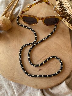 Handmade glasses chain or necklace  I string the beads one by one and then knit them. It is not gluing. Handmade Black Necklaces For Summer, Handmade Black Necklace For Summer, Black Beaded Glasses Chains For Festival, Summer Gift Black Glasses Chains, Adjustable Black Beads Glasses Chains For Gift, Adjustable Black Beads Glasses Chains As Gift, Black Beaded Glasses Chains As Fashion Accessory, Trendy Black Beaded Glasses Chains, Black Beaded Glasses Chains For Fashion