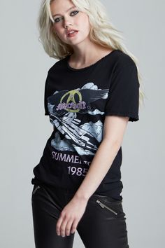 An iconic tee for one iconic band; this is a must-have item for any fan of the classic rock band Aerosmith. This classic oversized band tee features Aerosmith’s 1985 summer tour and is designed with authentic tour graphics on the front, and tour dates on the back. Made with soft cotton fabric, distressed edges, a wide crew neckline, a raw cut bottom hem, and a loose boyfriend tee fit. Details Style #301730B Color: Black Aerosmith Summer Tour 1985 Boyfriend T-Shirt 100% Cotton Care/Import Machine Black Grunge T-shirt For Summer, Summer Distressed Band Merch T-shirt, Washed Black T-shirt For Summer Streetwear, Grunge Graphic Print Summer Tops, Grunge Graphic Print Top For Music Festival, Summer Graphic Print Washed Black T-shirt, Edgy T-shirt For Spring Music Festival, Spring Concert T-shirt With Graphic Design, Black T-shirt For Spring Music Festival