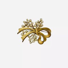 Crown Trifari Faux Pearl Bow Brooch Flower Floral Spray GoldTone Vintage | eBay Elegant Gold Brooches For Spring, Elegant Spring Brooch Jewelry, Elegant Flower Brooch For Spring, Elegant Spring Brooch, Elegant Spring Gift Brooches, Brooch Flower, Pearl Bow, Bow Brooch, Crown Trifari