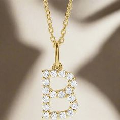 Personalized sparkle! Crafted with precision and elegance, our Diamond Initial Pendant features a 14K solid gold design and sparkling lab-grown diamond accents. Pick between rich yellow gold or sparkling white gold. This necklace is 18" with a jump ring at 16" for adjustability. Add a personal touch with your or a loved one's initials to any outfit and stand out with this luxurious personalized piece. Yellow Gold Pendant Initial Necklace With Diamond Accents, Gold Diamond Necklace With Lab Grown Diamonds, Dazzling Yellow Gold Necklace With Lab Grown Diamonds, Dazzling Yellow Gold Necklace With Lab-grown Diamond, Yellow Gold Initial Pendant Necklace With Brilliant Cut, Yellow Gold Initial Necklace With Diamond Accents, Yellow Gold Brilliant Cut Initial Pendant Necklace, Yellow Gold Initial Necklace With Diamond Accents As Gift, Gold Initial Necklace With Diamond Accents