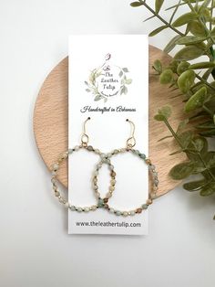 These beaded hoop earrings showcase a beautiful assortment of stone beads, each one adding its unique shade.  Perfect for adding a touch of bohemian flair to any outfit, these lightweight earrings are both stylish and comfortable, ideal for daily wear. Ear wires are gold plated stainless steel. DROP LENGTH:  Just under 2.5" WIDTH:  1.50" Thank you for Shopping The Leather Tulip.  I appreciate your support! https://instagram.com/theleathertulipboutique Bohemian Crystal Earrings With Faceted Beads, Bohemian Dangle Hoop Earrings With Faceted Beads, Bohemian Wire Wrapped Beaded Earrings For Everyday, Bohemian Beaded Hoop Earrings For Everyday, Everyday Bohemian Beaded Hoop Earrings, Bohemian Hoop Earrings With Natural Stones For Jewelry Making, Bohemian Hoop Beaded Earrings With Faceted Beads, Bohemian Hoop Earrings With Round Beads For Everyday, Bohemian Hoop Earrings With Faceted Beads