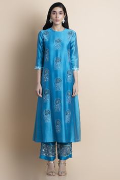 Editor's Note Featuring a skydive blue embroidered kurta in chanderi comes with matching parallel pants in chanderi with organza panel featuring tonal hand embroidery. Color: Blue Fabric: Chanderi Care: Dry Clean Only Customize Your OutfitCan't find the size you're looking for? No stress. Just select the size "Custom" while adding the item to your cart. We will follow up with you for your body measurements. To request a color or design customizations, please contact our customer care by using ou Parallel Pants, Embellished Pants, Chanderi Kurta, Kurta Set For Women, Cotton Kurti Designs, A Line Kurta, Embroidered Neckline, Kurta Set, Kurti Designs