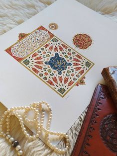 an intricately designed card with pearls and beads