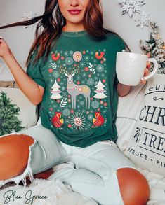 🍄 Scandinavian Christmas design exclusively from PoohBearCo 🍄 Cottagecore woodland aesthetic with deer, foxes, snow & botanicals 🍄 Comfort Colors brand, 100% ringspun cotton 🍄To ensure sizing, refer to size chart in photos and compare measurements to those of a sweatshirt you already own that fits well. 🍄 Non-toxic, eco-friendly, water-based inks safer for you & the environment. This listing is for 1 (one) Scandinavian Christmas oversized tee. ★ Hand-drawn graphic is exclusive to our shop. Christmas Printed Crew Neck Top, Christmas Graphic Print Short Sleeve Tops, Christmas Short Sleeve Relaxed Fit Tops, Christmas Relaxed Fit Short Sleeve Tops, Relaxed Fit Short Sleeve Christmas Tops, Green Short Sleeve Holiday Top, Green Short Sleeve Top For Holiday, Holiday Short Sleeve Printed Top, Green Graphic Print Top For Holiday