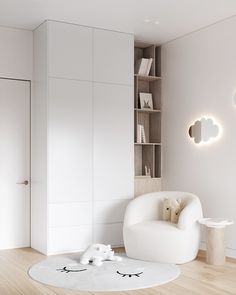 a living room with white furniture and bookshelves on the wall, in front of a bookcase