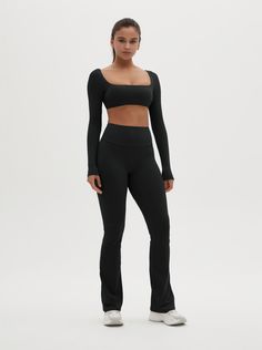 The Zoey Long Sleeve Active Crop Top seamlessly combines style and comfort, making it an essential piece for your activewear wardrobe. This top is designed to offer support and freedom of movement, perfect for any workout or casual outing. Fit and Features: Fitted design provides excellent support and a flattering fit. Long sleeves with thumbholes ensure a secure and comfortable fit during activities. Buttery soft fabric feels like a second skin for ultimate comfort. Four-way stretch material en Versatile Solid Activewear With Stretch, Versatile Solid Stretch Activewear, Athleisure Tops With Built-in Bra For Training, Casual Activewear With Built-in Bra For Loungewear, Yoga Tops With Built-in Bra And Compression, Gym Activewear With Built-in Bra And Minimal Stretch, Versatile Elastane Sports Bra For Pilates, Fitted Yoga Pants With Built-in Bra For Sports, Versatile Compression Sports Bra