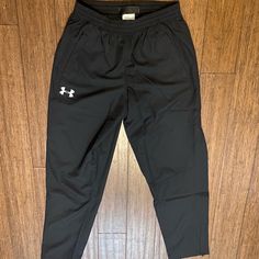 Brand New Under Armour Sweatpants Size Medium, Black Zipper At Bottom Of Legs Never Worn Mens Underarmour Sweatpants, Black Casual Under Armour Sweatpants, Casual Under Armour Pants, Under Armour Bottoms With Pockets, Under Armour Black Sweatpants With Pockets, Under Armour Casual Streetwear Pants, Under Armour Bottoms With Pockets For Streetwear, Under Armour Black Pants With Elastic Waistband, Under Armour Streetwear Bottoms With Pockets