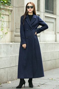 This woman long wool coat in navy blue is a timeless winter piece that will add a divine pop of color to your winter wardrobe.  This coat is a stunning color, lovely length, and keeps me warm.  Endlessly versatile, layer it over jeans and sweaters or sleek dresses for countless styling options.  FEATURES 50% wool, 50% fiber,nylon Polyester lining Double-breasted button closure Long sleeve coat Two side pockets Ankle length Perfect for winter, autumn Dry clean ★★ The model's height approx 170 cm (5′ 7″) with the 84 cm (33") bust, 66 cm (26") waist. She is wearing the wool coat in size XS (US2) ★★Bespoke Order Service Request other color Request the Length Request the sleeve length Your height is not between 155cm- 175cm Your weight is not between 47kg -77kg  ★★ Get your size in Size Chart w Navy Wool Long Coat, Double-breasted Winter Office Peacoat, Double-breasted Peacoat For Office In Winter, Winter Office Peacoat With Buttons, Navy Wool Winter Coat With Button Closure, Navy Wool Coat With Button Closure For Winter, Navy Peacoat With Notch Lapel For Winter, Long Pea Coat For Office, Single Breasted Long Peacoat For Cold Weather