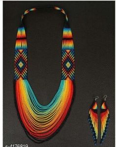 a multicolored necklace and matching earrings are on display in front of a black background