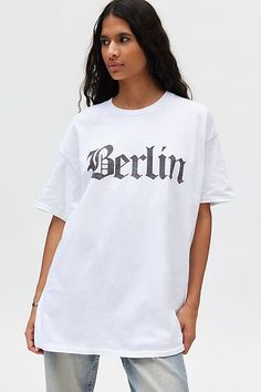 T-shirt dress featuring a Berlin graphic across the chest. Perfect as an oversized graphic tee or mini dress! Only at Urban Outfitters. Features Berlin graphic t-shirt dress Oversized graphic tee Soft and stretchy jersey knit Crew neckline with drop shoulders and short sleeves Berlin graphic across the front Relaxed, slouchy fit Tunic length Easy pull-over style UO exclusive Content + Care 100% Cotton Machine wash Imported Size + Fit Model in White is 5’9.5" and wearing size S/M Measurements tak Fitted Tunic, Bdg Jeans, Oversized Graphic Tee, Tunic Length, Jeans For Sale, T Shirt Dress, Crew Neckline, Knit Jersey, Urban Outfitters