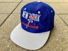 90s New York Yankees Snapback by Campri / Beautiful Design / Vintage MLB Sports Cap / NY Yankees Cap Label: Campri Size: one size Condition: very good condition ( please check the pics carefully ) Color: blue, white, red ----------------------------------------------------------------------------------- MEASUREMENTS: Diameter (front to back): 7 INCH ( 18 cm ) Please check measurements carefully or ask if you are not sure about the size! I cannot give refunds due to ill fitting garments --------- Vintage Sports Hat With Letter Print, Throwback Baseball Cap With Visor For Sports, Retro Sports Baseball Cap, Throwback Trucker Hat For Sports, Vintage Baseball Cap For Sports, Retro Sports Baseball Cap With Letter Print, Retro Trucker Hat With Letter Print For Sports, Retro Sports Hat With Letter Print, Retro Letter Print Trucker Hat For Sports