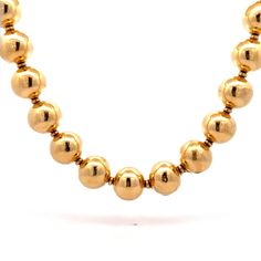 "17\" Hollow Gold Bead Necklace in 18k Yellow Gold This modern beaded gold necklace creates quite the visual impact. Crafted from 18 karat yellow gold, the necklace is composed of hollow gold beads strung on a polished 18 karat yellow gold chain. The necklace is lightweight yet substantial, perfect for moments when the \"WOW\" factor is needed. The hollow gold beads have a high polished finish, making them glimmer and shine in the light. This necklace is the perfect blend of modern and classic, Classic Yellow Gold Beaded Necklace With Round Beads, Luxury Yellow Gold Beaded Necklaces For Formal Occasions, Luxury Yellow Gold Beaded Necklace For Formal Occasions, Classic Yellow Gold Beaded Necklace, Luxury Gold Beaded Necklace With Polished Beads, Luxury Gold Beaded Necklaces With Beaded Chain, Luxury Beaded Yellow Gold Necklace, Luxury Beaded Necklace With Round Beads, Yellow Gold Beaded Round Necklace