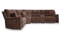 a brown sectional sofa with recliners and pillows on the bottom half of it