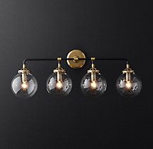 an image of a bathroom light fixture with five lights on it's side and three bulbs attached to the wall