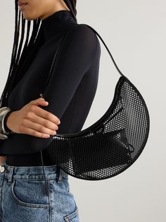 Alaïa's 'Demi' bag is named after its half-moon shape. Made from mesh, it's trimmed with contrasting leather and has enough space inside to stow your phone, wallet, keys, lip gloss and mints - we suggest keeping the smaller items in the accompanying zip pouch so they don't slip out or get caught in the open construction. Mesh Shoulder Bag For Shopping, Shopping Shoulder Bag With Mesh Lining, Summer Mesh Shoulder Bag For Shopping, Black Mesh Bag For Daily Use, Black Mesh Bags For Daily Use, Designer Summer Evening Shoulder Bag, Designer Evening Shoulder Bag For Summer, Leather Shoulder Bag For Summer Evenings, Summer Evening Bag With Round Handle