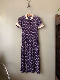 "1940s Loralyn Cotton Day Dress Loving this pattern! A bit of fading around the shoulders but nothing major, some light staining around the collar, and a few small repair. Made of thinned out cotton, a bit see-through. Measured flat: Shoulders 13\" Pit to pit 16\" 1/4 Waist 14\" Hips open Length 45\" PLEASE READ! *MEASUREMENTS* All items are measured while laying flat and unstretched. For clothing: chest, waist, hip and thigh measurements should be multiplied by two. All measurements are in inch Vintage Tea-length Dresses, Mid-century Style Short Sleeve Vintage Dress, Vintage Dress With Peter Pan Collar For Daywear, 1950s Vintage Dress With Summer Pattern, Retro Vintage Dress With Peter Pan Collar, Retro Vintage Dress Tea Length, Retro Tea-length Lined Vintage Dress, Retro Lined Tea-length Vintage Dress, Retro Vintage Tea-length Dress