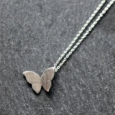 Silver Butterfly Necklace These are petite and lovely pieces perfect for giving to a special someone or as a gift to yourself. Butterfly with sterling silver Chain - sterling silver chain - Silver matte plated butterfly pendant - Made to order at your length. Please see description of length below and choose one. 15 inches: around neck 16 inches: standard short 17 inches: average length 18 inches: standard long 19 inches: falls on chest 20 inches: falls on chest --------------------------------- Matte Plates, Butterfly Necklace Silver, Silver Butterfly Necklace, Simple Butterfly, Necklace Butterfly, Silver Butterfly, Butterfly Necklace, Butterfly Pendant, Pendant Silver