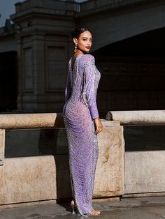 This Kaede Crystal Chain Fringe Mesh Maxi Dress is a show-stopping piece that will add a touch of dazzle to any special occasion. The mesh fabric is adorned with chains and crystals, creating a beautiful fringe effect that adds movement and texture to the dress. The purple color adds a regal and sophisticated touch, making this dress a must-have for any fashion-forward individual.    Material: 100% Polyester    Invisible zipper opening at the back   Stretch Factor:  Low   Stretch    Clean: Dry c Purple Maxi, Purple Maxi Dress, Chain Fringe, Mesh Maxi Dress, Image Model, Jumpsuits And Romper, Feather Dress, Crystal Chain, Grand Entrance