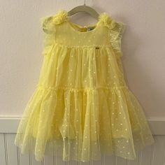 This Beautiful Tulle Plumeti Yellow Dress Designed In Spain Is Brand New Dress Perfect For Summer Parties, Weddings And Birthdays. The Dress Is Lined With Very Soft Fabric Making It Very Comfortable To Wear Holiday Sleeveless Tulle Dress, Sleeveless Tulle Dress For Holiday, Sleeveless Tulle Holiday Dress, Spring Holiday Princess Dress, Holiday Princess Dress For Spring, Princess Style Sleeveless Tutu Dress For Holiday, Holiday Princess Style Sleeveless Tutu Dress, Yellow Tulle Dress For Dress-up Occasions, Yellow Tulle Formal Dress