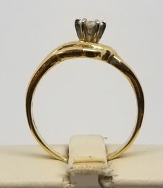 "We do not check prongs for wear or stones for looseness. All items are sold as is-noting that we are a resale shop so everything here had a previous owner! We will include flaws in the description when noted. This is one of the reasons our items are more affordable than new at a jewelry store. Vintage 14K Yellow Gold Fused Ring Set with a .30 Carat Round Diamond, Size 6.5. There is 4 smaller diamonds below main stone. Stamped 14K inside band. Weighs 2.2 dwt. Please stop in often as we will be a Round Diamond Size, Resale Shops, Please Stop, Bridal Sets, Jewelry Store, Round Diamond, Ring Set, Ring Sets, Jewelry Stores