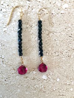 Black Spinel Earrings featuring beautiful 4MM faceted spinel cube stones accented with an 8MM teardrop faceted pink quartz stone.  Gold filled ear wires.  Handmade earrings Elegant Faceted Briolette Crystal Earrings, Elegant Briolette Faceted Crystal Earrings, Elegant Briolette Crystal Earrings, Elegant Black Spinel Jewelry With Faceted Beads, Black Faceted Beads Earrings For Gift, Black Faceted Bead Earrings For Gift, Black Faceted Beads Earrings For Party, Black Faceted Earrings As A Gift, Faceted Beads Briolette Earrings For Gift