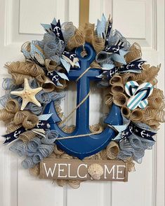 a welcome wreath with an anchor and starfish