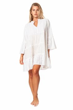 Camella Casual Mini Dress by La Moda. Just as effortless as it is essential, this stunning mini dress is featured in a tiered relaxed body with exaggerated sleeves. The perfect throw-on-and-go mini to pair with a staple sandal in the warmer months or a bold boot in the colder, this cool and classic dress is sure to be your go-to from season to season. 100% Cotton This is a unique garment. The imperfections in these fabrics are not considered defects, but characteristics that make them authentic. Flowy Tiered Dress With Ruffle Sleeves For Summer, Summer Flowy Tiered Dress With Ruffle Sleeves, Summer Tiered Dress With Flowy Ruffle Sleeves, Flowy Ruffle Sleeve Tiered Vacation Dress, Summer Tiered Dress For Daywear, Flowy Tiered Dress With Ruffle Sleeves For The Beach, Flowy Tiered Dress With Ruffle Sleeves For Vacation, Ruffle Sleeve Tiered Dress For Vacation, Flowy Tiered Ruffle Dress For Beach