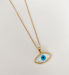 Evil eye necklace/charm Dainty mother of pearl and 18k gold plated eye charm. It will help you to stay away or protected from negative energies, bad vibes, envy, evil eye. Ideal for gifts. It's available only the charm or with the chain. MATERIAL AND SIZE 18k Gold plated Evil eye Mother of pearl 18k Gold filled chain Length: You can choose it If you have questions about the product, feel free to reach me out. Don't forget to check out my other items in the store: Https://www.etsy.com/shop/nyahwi Gold Evil Eye Amulet Jewelry, Gold Plated Evil Eye Amulet Jewelry, Spiritual Gold Plated Evil Eye Jewelry, Gold Plated Evil Eye Round Pendant Jewelry, Gold Plated Evil Eye Amulet Necklace, Gold-plated Evil Eye Amulet Necklace, Everyday Evil Eye Pendant Necklace, White Evil Eye Round Pendant Necklace, Gold Plated Evil Eye Jewelry As Gift