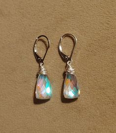 Rainbow quartz earrings dangle approx 1 inch from lobe. Elegant yet sweet these have amazing clarity and cut. Elegant earrings. Matching necklace available as well. Checkout my other (longer) moonstone quartz earrings here: https://www.etsy.com/listing/694597484/long-rainbow-moonstone-quartz-earrings Gold filled Rose gold filled Sterling silver Blue Lace Agate Earrings, Earrings Matching, Larimar Earrings, Rainbow Quartz, Agate Earrings, Blue Lace Agate, Quartz Earrings, Matching Necklaces, Lace Agate