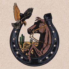 a horse with an eagle on it's back sitting in front of a cactus