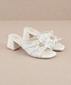 The Emerald | White Double Bow Peep Hole Sandal – Oasis Society Bridal Slip On Shoes, White Formal Shoes, Unique Bridal Shoes, Cute White Sandals, Wedding Shoes Vintage, Emerald Blue, Classy Shoes, Double Bow, Wrap Heels