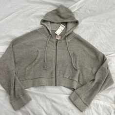 Urban Outfitters Bdg Leah Waffle Knit Zip-Up Hoodie Sweatshirt Size Small Condition: Nwt Color: Grey Details : - Classic Hoodie Silhouette In Ultra-Soft Waffle Thermal Knit. - Zip-Up Hoodie Style - Cropped To The Waist And Cut In An Easy Relaxed Fit With A Cozy Hood And A Zip Closure At The Front. - With Side Pockets. - Thermal Sweatshirt In A Loose, Cropped Fit Extra: - I Ship Between 1-2 Days Trendy Knit Sweatshirt For Loungewear, Ribbed Hooded Hoodie For Loungewear, Hooded Ribbed Tops For Loungewear, Ribbed Hoodie For Loungewear, Ribbed Hooded Top For Loungewear, Casual Knit Outerwear For Loungewear, Winter Ribbed Hoodie For Loungewear, Casual Ribbed Hooded Top, Winter Cotton Hoodie With Ribbed Details