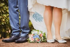 the bride and groom are standing next to each other