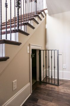 the stairs in this house are made of wood and wrought iron