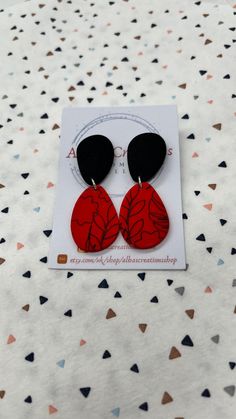 Handmade red and black pattern polymer clay statement earrings. All of my earrings are made out of polymer clay and using 925 sterling silver findings. My polymer clay earrings are handmade in United Kingdom; Please bear in mind that the earrings that you will receive may differ slightly from the image and there may be minor imperfections in each piece. That is why you are going to receive and have a modern, different and unique pair of earrings! Colours on computers monitors and screens may vary; so if you have any questions about these earrings, please send me a message prior to purchase and I will be honoured to give you the most detailed description I can. All the items will be posted in a large letter box and send via Royal Mail 1st Class; and if you order comes from UK it will be fre Handmade Red Polymer Clay Earrings, Red Drop Earrings In Polymer Clay, Hand Painted Red Polymer Clay Earrings, Red Hand Painted Polymer Clay Earrings, Red Polymer Clay Dangle Jewelry, Red Polymer Clay Drop Earrings, Trendy Red Hand Painted Earrings, Elegant Red Polymer Clay Earrings, Everyday Red Polymer Clay Jewelry