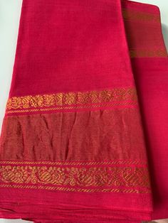 Be the stunner in these Madurai handloom plain cotton sarees with simple gold zari tissue border.  Can choose saree colours from  Rama Blue (Cerulean), Dark Aubergine Purple (Navapazham/ jamun purple), Hot Pink or Algae Green (Paasi pachai). Sari length is 5.5 m. Does not come with blouse. Saree edge is done.  Can be paired with any gold, off white or contrast colour blouse for a rich look.   Sarees come starched and becomes very soft & pliable on handling  & ironing. Disclaimer:  -There might b Cotton Pre-draped Saree With Self Design For Festivals, Festive Cotton Pre-draped Saree With Zari Weaving, Gold Cotton Silk Saree With Traditional Patterns, Bollywood Style Cotton Saree With Border, Bollywood Cotton Saree With Border, Gold Cotton Dupatta, Cotton Saree With Self Design For Traditional Ceremonies, Navratri Cotton Saree With Border Detail, Cotton Saree With Border For Festivals