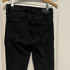 American Eagle High Rise Black Jegging Next Level Stretch Size 4 Regular Length Jeans. Black Mom Jeans American Eagle, Black Mid-rise Elastane Jeggings, Black American Eagle Jeans, Black Non-stretch Mid-rise Jeggings, Mid-rise Black Denim Jeggings, Jean Jeggings, American Eagle Outfitters Jeans, Jeggings, Colored Jeans