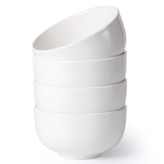 four white bowls stacked on top of each other