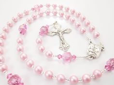 "- Personalized handmade rosary made with pink Czech glass pearls and crystals - Choice of medals and letters - Comes with a velour pouch and gift box This is for a little girl who LOVES PINK! This bubblegum pink handmade baptism rosary is made with matte pink Czech glass pearls and crystals and big pink Czech cathedral beads. It's a very cheerful rosary design. Comes with your choice of Baptism, First Communion, Confirmation, or other medals. Read below for details. Over 80 colorful designs to Spiritual Pink Jewelry For Birthday, Pink Beaded Spiritual Rosary, Pink Spiritual Jewelry For First Communion, Pink Rosary With Round Beads For First Communion, Pink Rosary For First Communion, Pink 8mm Bead Jewelry For Valentine's Day, Handmade Pink Rosary For First Communion, Pink Rosary With 8mm Round Beads, Handmade Pink Rosary With Round Beads