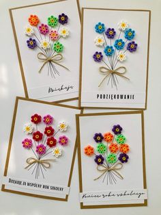 four cards with different colored flowers on them