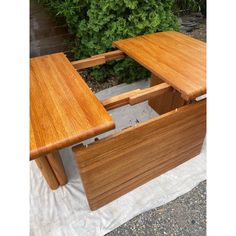 two wooden tables sitting next to each other