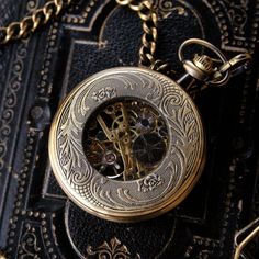 48mm antiqued brass mechanical pocket watch. On 30 inches of antiqued brass chain but I can make this any other length by request.. just let me know at checkout.Also available on a mens pocket chain. Along the edge of the watch lid are all the zodiac symbols. Both the front and back of the watch see through to the gear movement. The movement is mechanical and so will need wound every day when in use in order to keep accurate time. Each watch comes in a gift box with printed care instructions. Vintage Medallion Pocket Watch With Skeleton Dial, Vintage Skeleton Dial Pocket Watch As Gift, Vintage Bronze Metal Pocket Watch, Antique Bronze Metal Pocket Watch, Steampunk Engraved Pocket Watch As Gift, Vintage Metal Pocket Watch With Antique Finish, Antique Gold Metal Pocket Watch With Antique Finish, Gold Engraved Steampunk Pocket Watch, Vintage Brass Bronze Pocket Watch