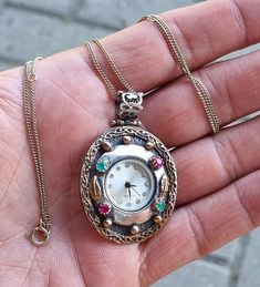 Vintage Handmade Silver 925 Necklace Pendant Women's Quartz Watch w Multi Gemstones  Very nice watch   Watch in working order - RUNS New battery installed  Caliber : Japan Miyota  Case solid silver 925 , marked 925 Case size without ring for cord/chain : 32x37 mm With multi Gemstones  Also case gold plated  Gold plated silver 925 chain length 42-44-47-52 or 57 cm  Fine vintage condition  PLEASE NOTE Vintage Jewelry & Watches : Please be aware that vintage jewelry / watches often has some signs o Nice Watch, Pretty Accessories, Long Pendant Necklace, Silver 925 Necklace, Watch Necklace, Gold Plated Silver, Cool Watches, Necklace Pendant, Quartz Watch