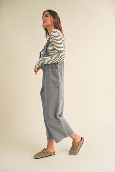 The vintage washed jumpsuit in dusty blue/gray boasts a loose fit and adjustable straps for maximum comfort. Complete with front pockets and faux back pockets, it offers a super cute casual look perfect for any occasion. Elevate your style with this must-have piece. -Fits true to size -70% Tencel/30% Rayon Deep Blue Color, Overall Jumpsuit, Earthy Outfits, Fall Is Here, Top Graphic Tees, Dress Romper, Hat Hairstyles, Dusty Blue, The Vintage