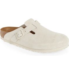 a white shoe with two straps on the front and one strap at the back, in suede