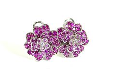 These wonderful pierced earrings feature a floral design and are each accented with 11, bead sets of round brilliant cut natural pink sapphires, and 2 round brilliant cut diamonds in the center.  The earrings measure 16.5mm X 16.5mm and are finished with omega-style backs. Vintage but like new! total weight earrings 7.9gram Sapphire 1.5 ctw approx #0024 Elegant Pink Sterling Silver Flower Earrings, Elegant Pink Flower Earrings In Sterling Silver, Pink Sapphire Earrings For Wedding, Elegant Pink Cubic Zirconia Flower Earrings, Pink Elegant Flower Earrings For Anniversary, Formal Pink Round Flower Earrings, Elegant Pink Flower Earrings, Formal Pink Flower Earrings, Pink Round Flower Earrings For Anniversary