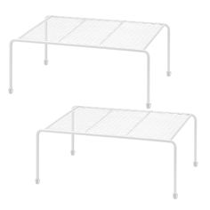 two white metal tables with wheels on each side and one is holding a wire shelf