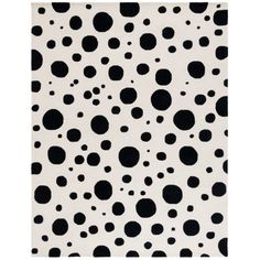 a black and white rug with dots on it