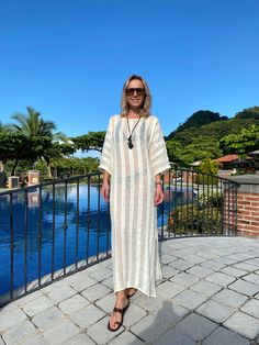 Evoke your inner goddess in our delightful Athena Kaftan. Perfect for an island resort vacation, this breezy linen kaftan will be a great cover-up solution if you want to throw something on top of your bikini. Or wear it over a slip dress, over shorts, even jeans. Athena Kaftan is one size. Due to its breathable transparency, you can purchase it together with our Leah cotton slip dress, that is available in sizes S, M, L. And then it can be worn as a maxi linen dress. Belt it up, if you like, an White Flowy Cover-up For Vacation, Oversized White Cover-up For Loungewear, Long Kaftan For Beach Resort, White Beachy Cover-up For Loungewear, White Beachwear Cover-up, Unlined Beach Kaftan For Beachwear, Unlined Beach Kaftan, Beachwear Unlined Kaftan For Beach, Beachwear Kaftan For The Beach